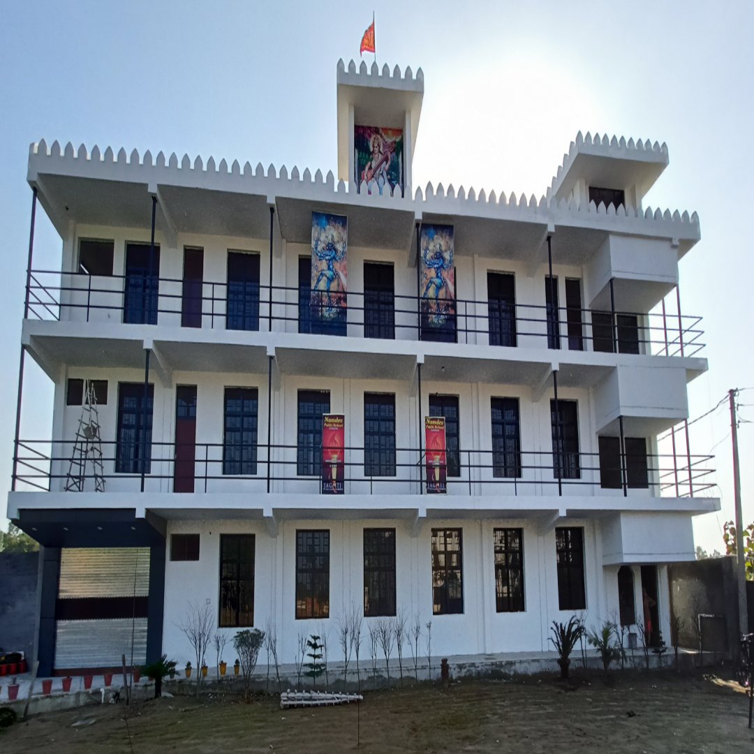 Modern school building with spacious classrooms and green surroundings