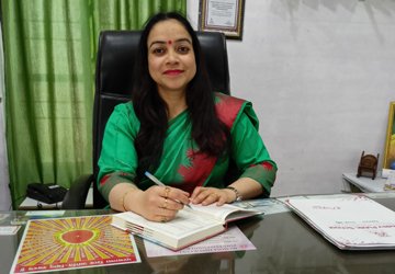 Experienced mathematics teacher with friendly smile in professional attire